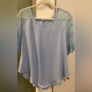 Light blue blouse with lace sleeves